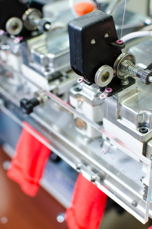 Machinery and equipment in a spinning production company interior design. Textile fabric