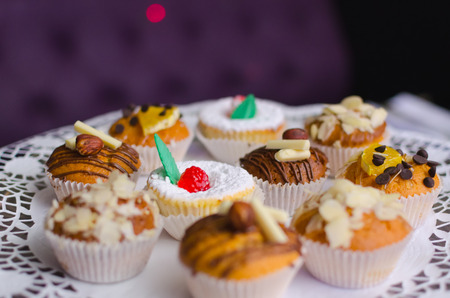Many sweet birthday cupcakes with butter creamの写真素材