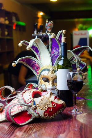 Close up beautiful Masquerade mask and red wine.の写真素材
