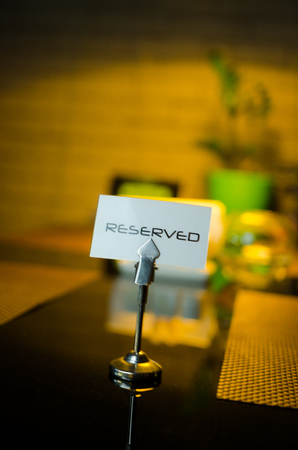 Reserved sign on a table in restaurant.の写真素材