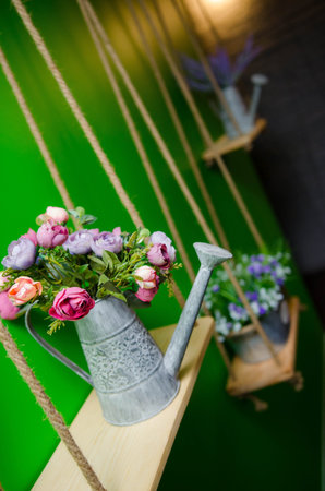 beautiful bouquet of bright wildflowers in watering can