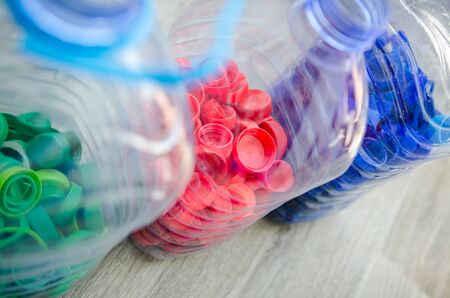 Selective focus, plastic bottle for recycle waste, Waste separation concept. waste recycling. Colored bottle capsの写真素材