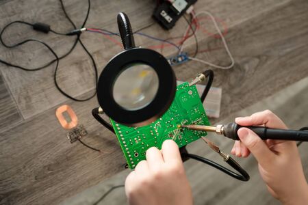 Repair of electronic devices, tin soldering parts.の写真素材
