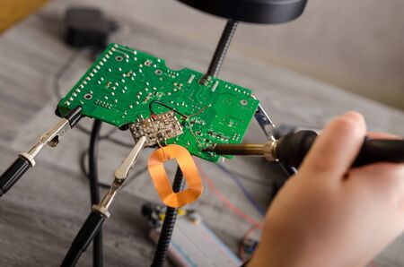 Repair of electronic devices, tin soldering parts.の写真素材