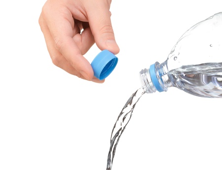 hand opened a bottle of water  water to pour from bottleの写真素材