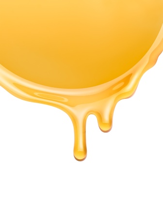 honey flowing on a white backgroundの写真素材