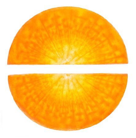 Carrot sliced similar to the pill on a white background. Symbol of a healthy lifestyle and natural medicine.の写真素材