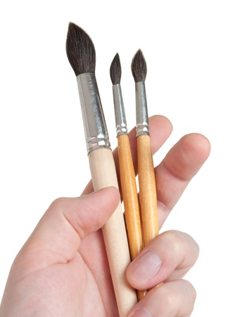 Brushes of various sizes in the handの写真素材