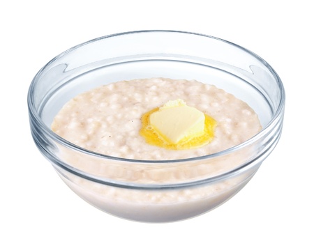 Oatmeal in a glass bowl on white backgroundの写真素材