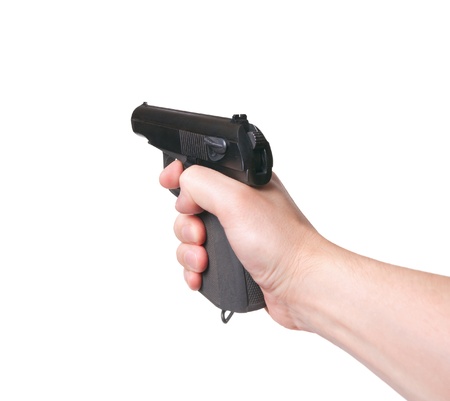 Gun in hand on a white background. Aimingの写真素材