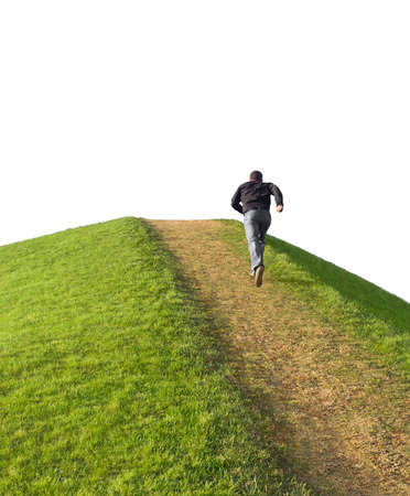 Pathway up the hill. Man ran to the top. Symbol development or career growth.の写真素材