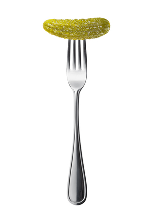 marinated pickled cucumber on a fork isolated on a white backgroundの写真素材