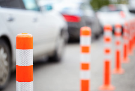 Orange bollards on the roadの写真素材