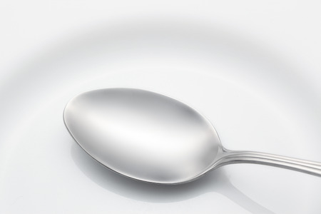 Spoon on a plateの写真素材
