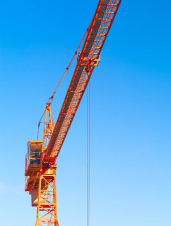 Hoisting crane. Fragment against the blue sky.の写真素材