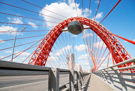 Red metal arch over the highway. Zhivopisny bridge. Moscow. Russiaの写真素材