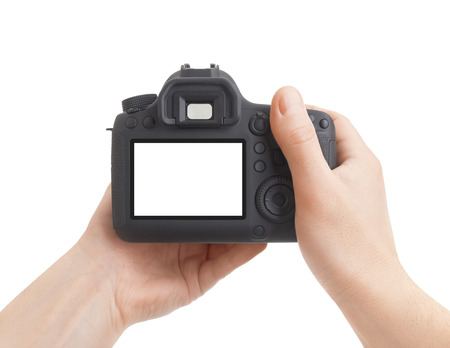 Camera in hand on white backgroundの写真素材