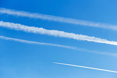 Contrails in the blue skyの写真素材