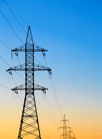 high voltage post against the evening or morning skyの写真素材