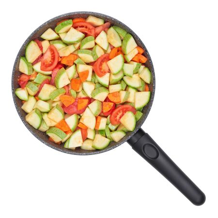 Vegetable ragout. Zucchini and tomatoes with carrots in a pan.の写真素材