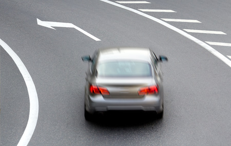 car on street with arrow directionの写真素材