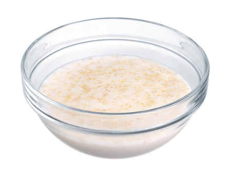 Oatmeal in a glass bowl on white backgroundの写真素材