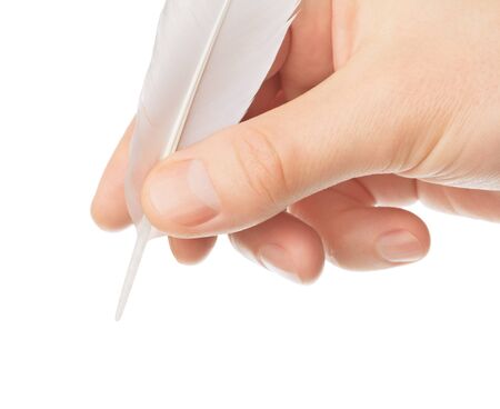 Hand writes something a bird's feather on white backgroundの写真素材