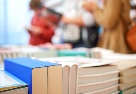 Books and people in the storeの写真素材
