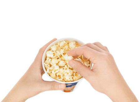 Eating popcorn on a white backgroundの写真素材