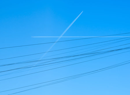 airplane paths crossed in the sky like wires