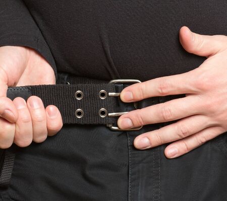 tightening the beltの写真素材
