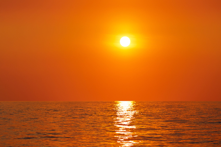Sunset or sunrise over a river or lakeの写真素材