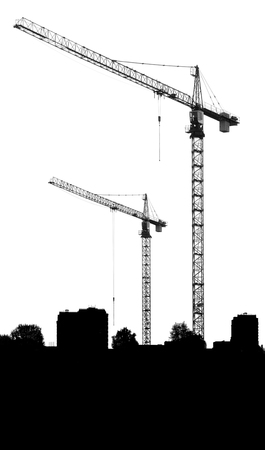 Construction site with cranes and silhouettes buildings on a white backgroundの写真素材