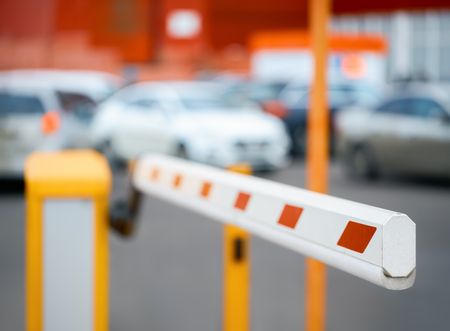 barrier close-up against the background of car parking             の写真素材