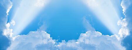 sky with clouds illuminated by rays of lightの写真素材