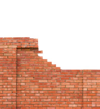 Brick wall under construction on white background                          の写真素材