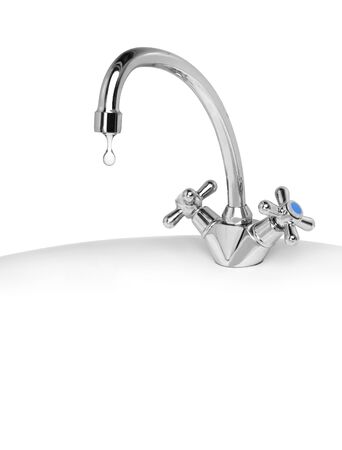 drop of water dripping from a tapの写真素材