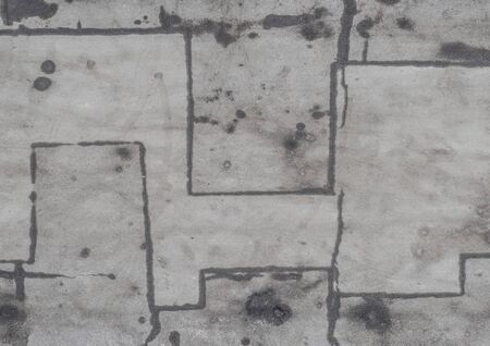 Asphalt pavement in the Parking lot with the tire tracks. The view from the top. Abstract background or texture.の写真素材