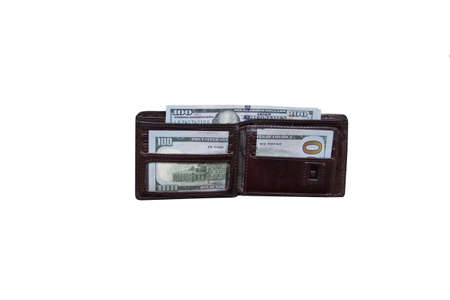 Wallet stands on a white background with dollars in pockets. Leather wallet with dollars on a white background.の写真素材