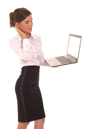 Young girl stands with a laptop in her hands.の写真素材