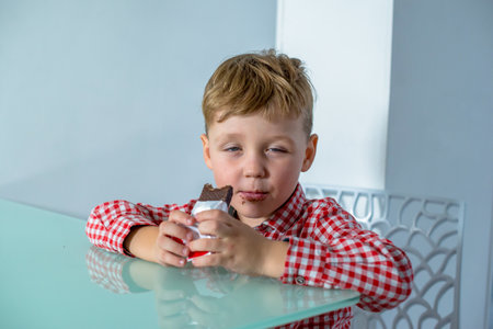 Dream interpretation little boy eats chocolate barの写真素材