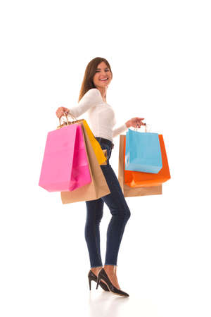 Young brunette with bags after a good shopping.の写真素材
