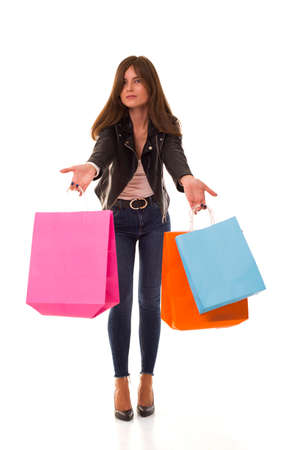 A Beautiful brunette with packages after shopping.の写真素材