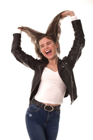 Cheerful girl throws her hair up and have fun.