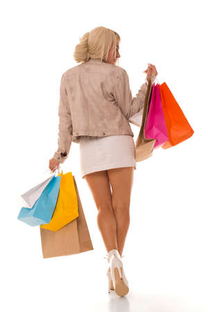 A Beautiful girl after shopping with purchases.の写真素材