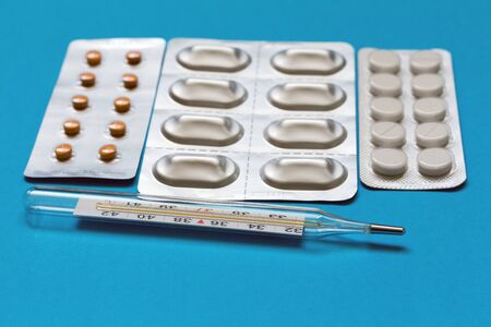 Tablets in blisters and thermometerの写真素材