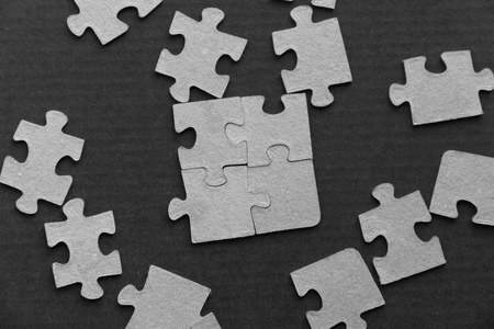 puzzle on a dark background. soft focus, blurの写真素材