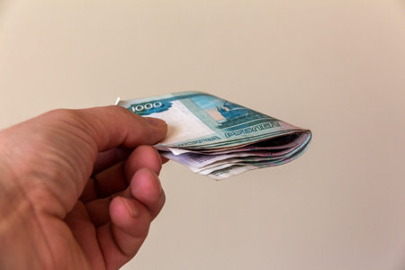 Russian money in a man's hand