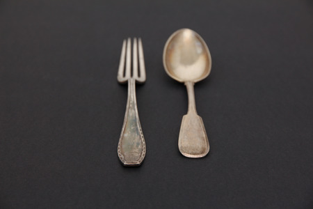 vintage old fork and spoon. silver. dark backgroundの写真素材