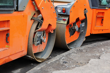 Road rollers during asphalt compaction works